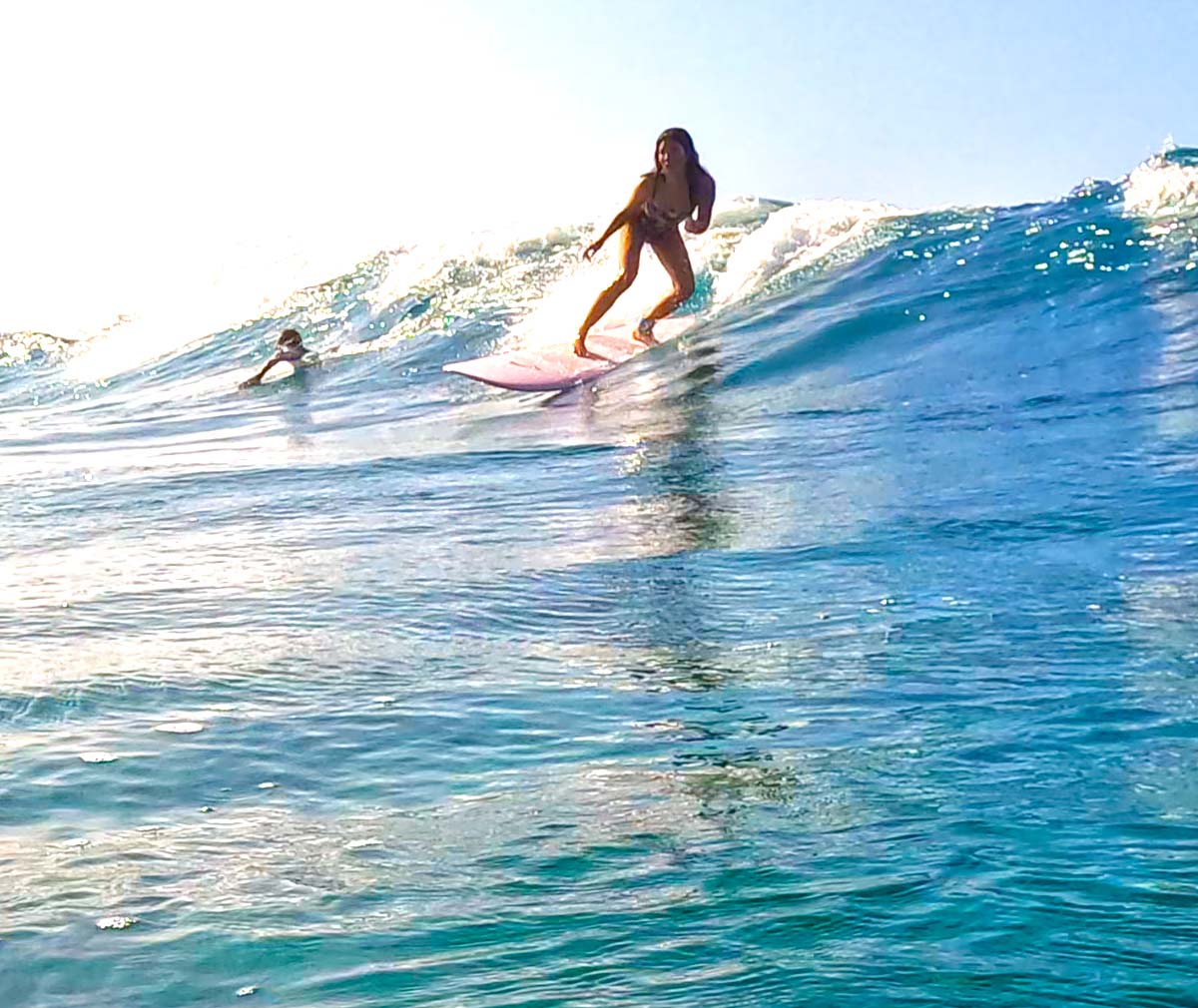 Girl surfing on wave